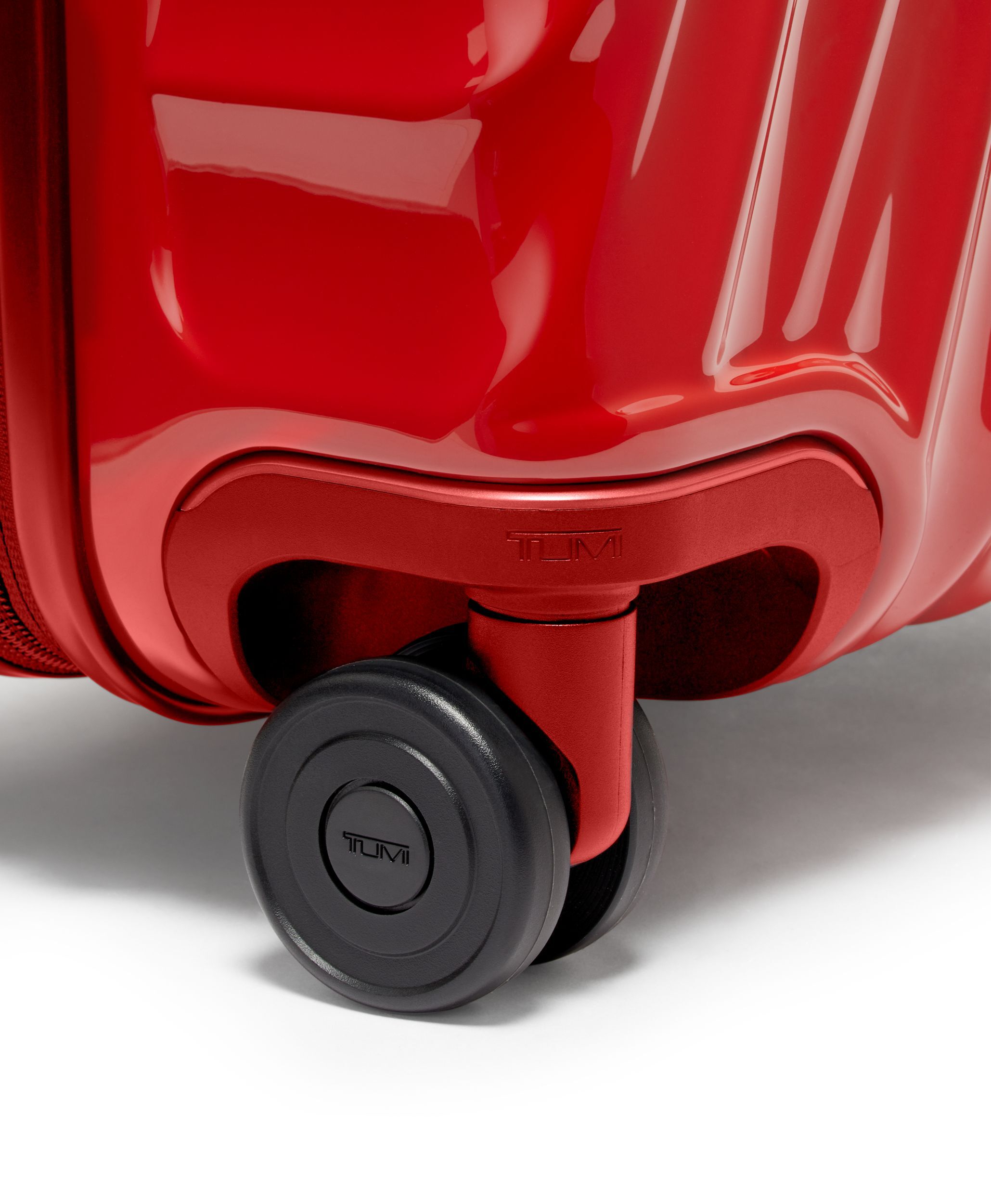 Tumi red carry on top